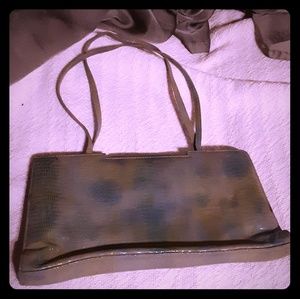 2 purses. The Kenneth cole is the olive purse....